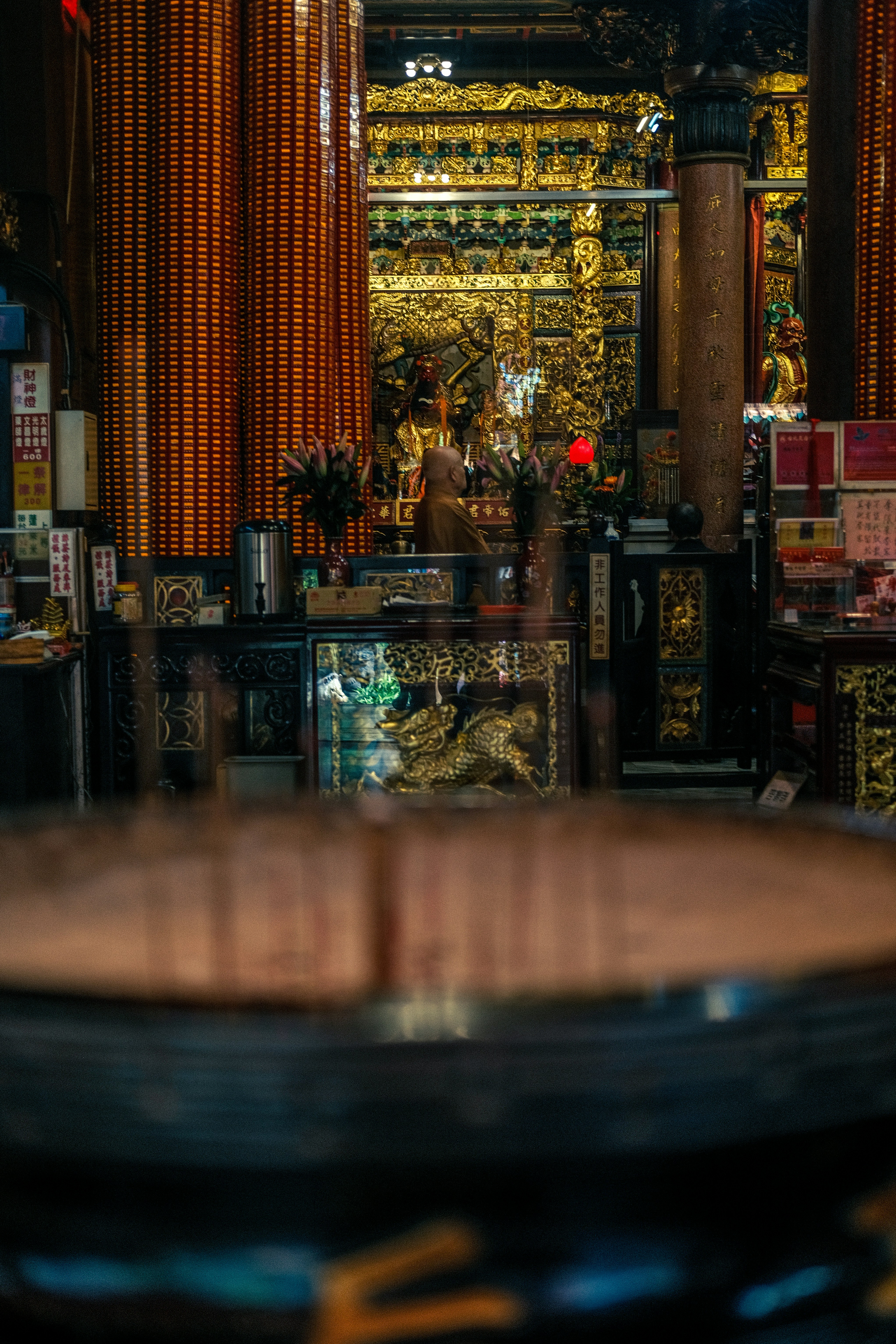 Inside a beautiful temple, rich in gold decor.