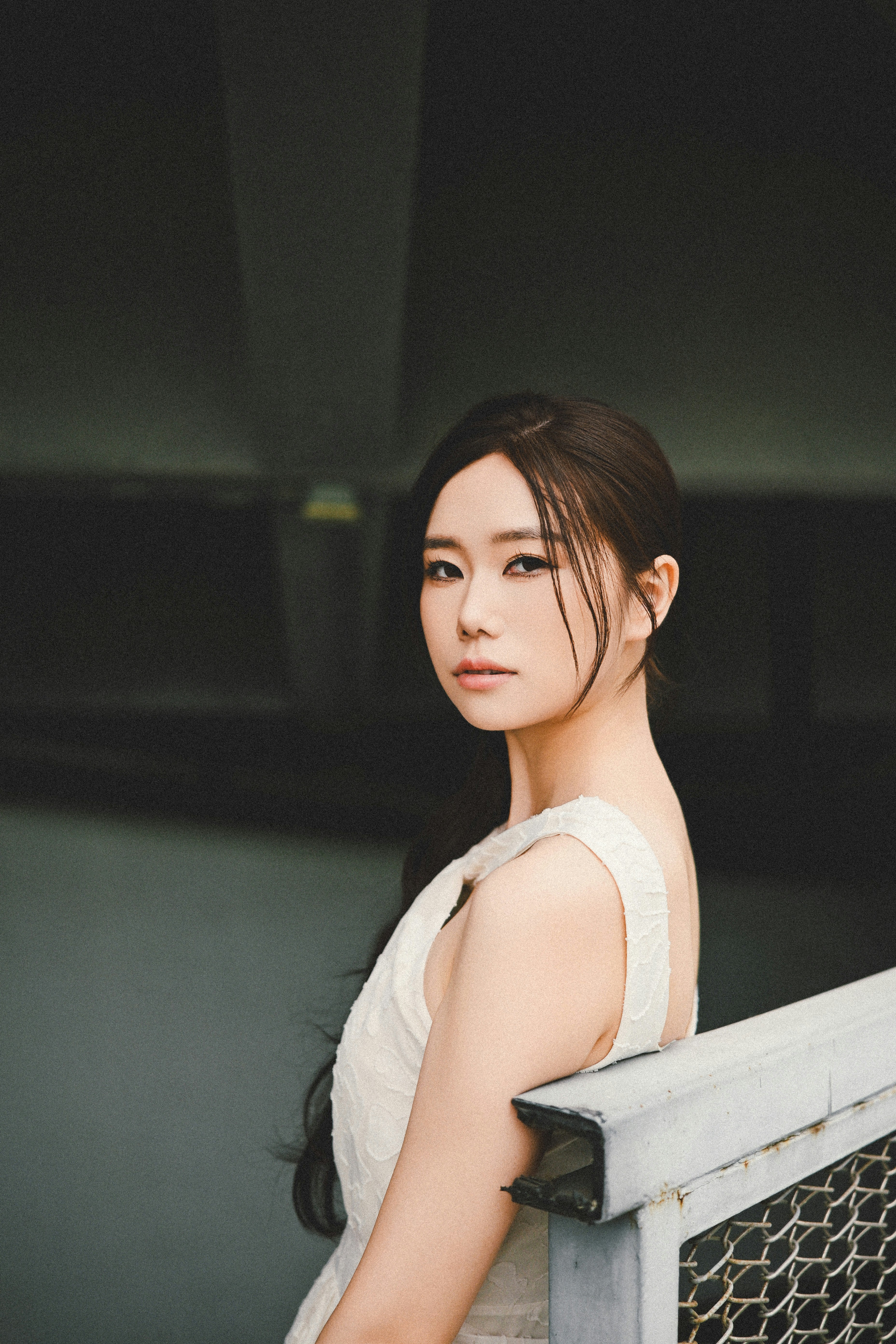 A beautiful woman poses with a striking gaze.