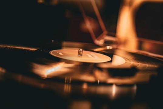 A vinyl record spins on the turntable.