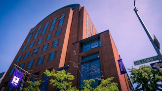 An nyu building stands tall on a sunny day.