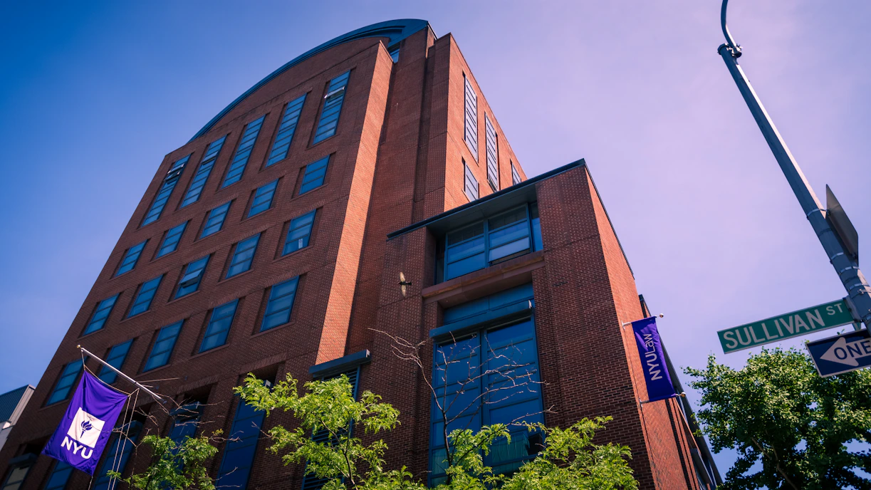 An nyu building stands tall on a sunny day.