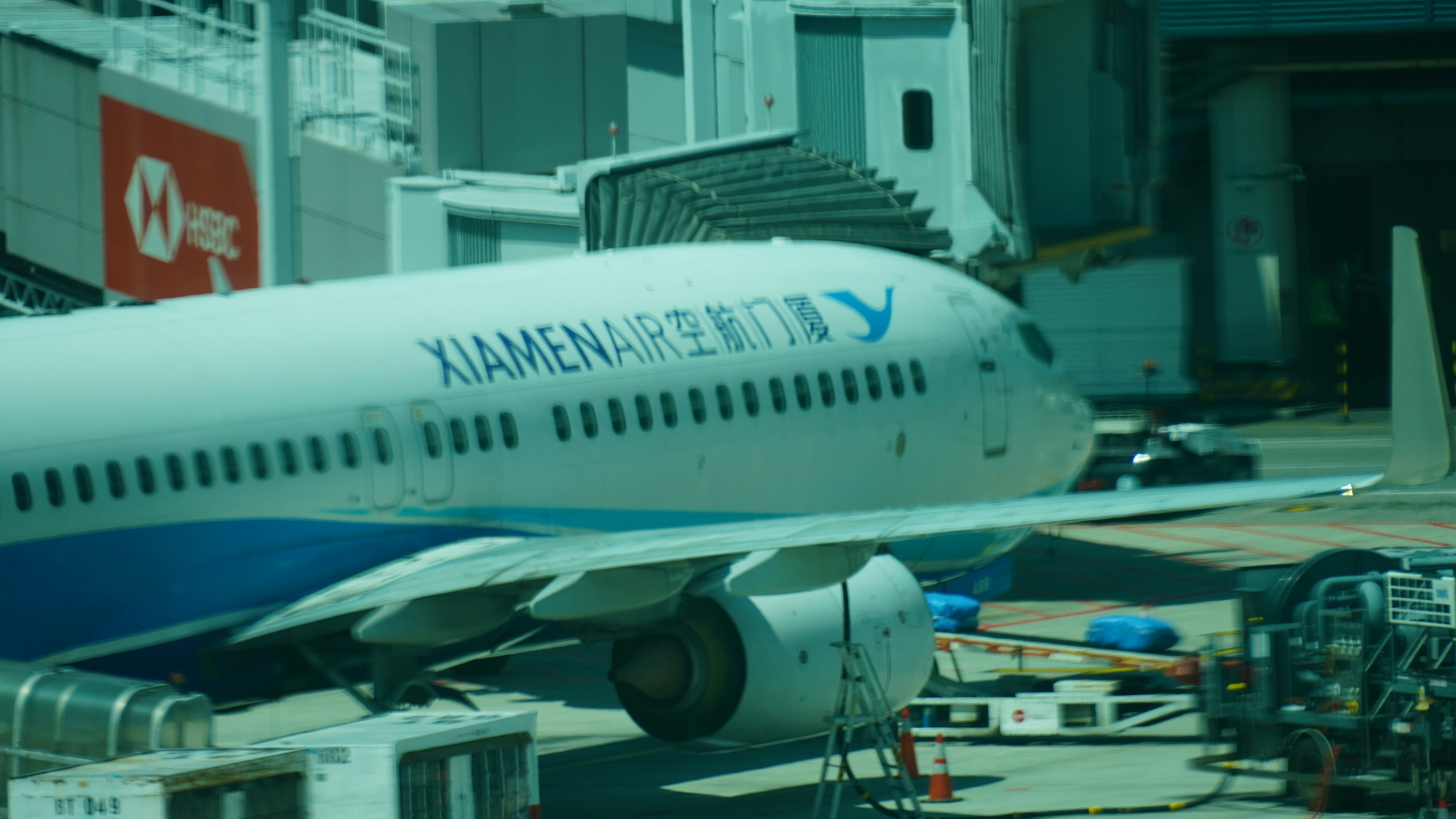 A xiamen airlines plane at an airport terminal.