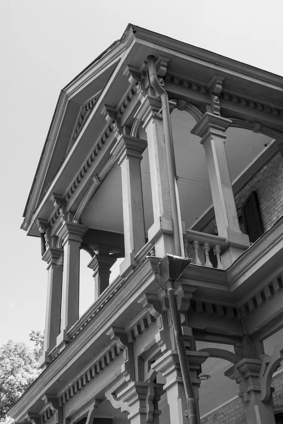 Black-and-white photo of a columned porch