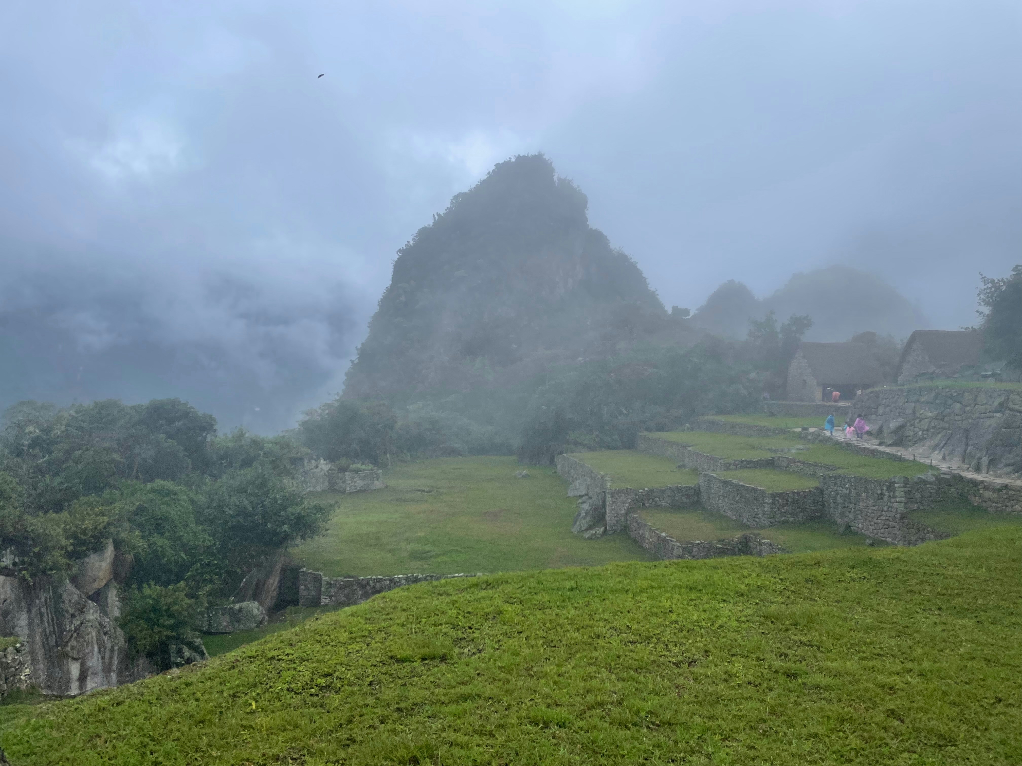 Machu picchu shrouded in clouds and mist.