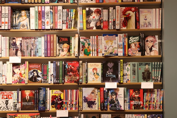 Bookshelves are filled with various manga and books.