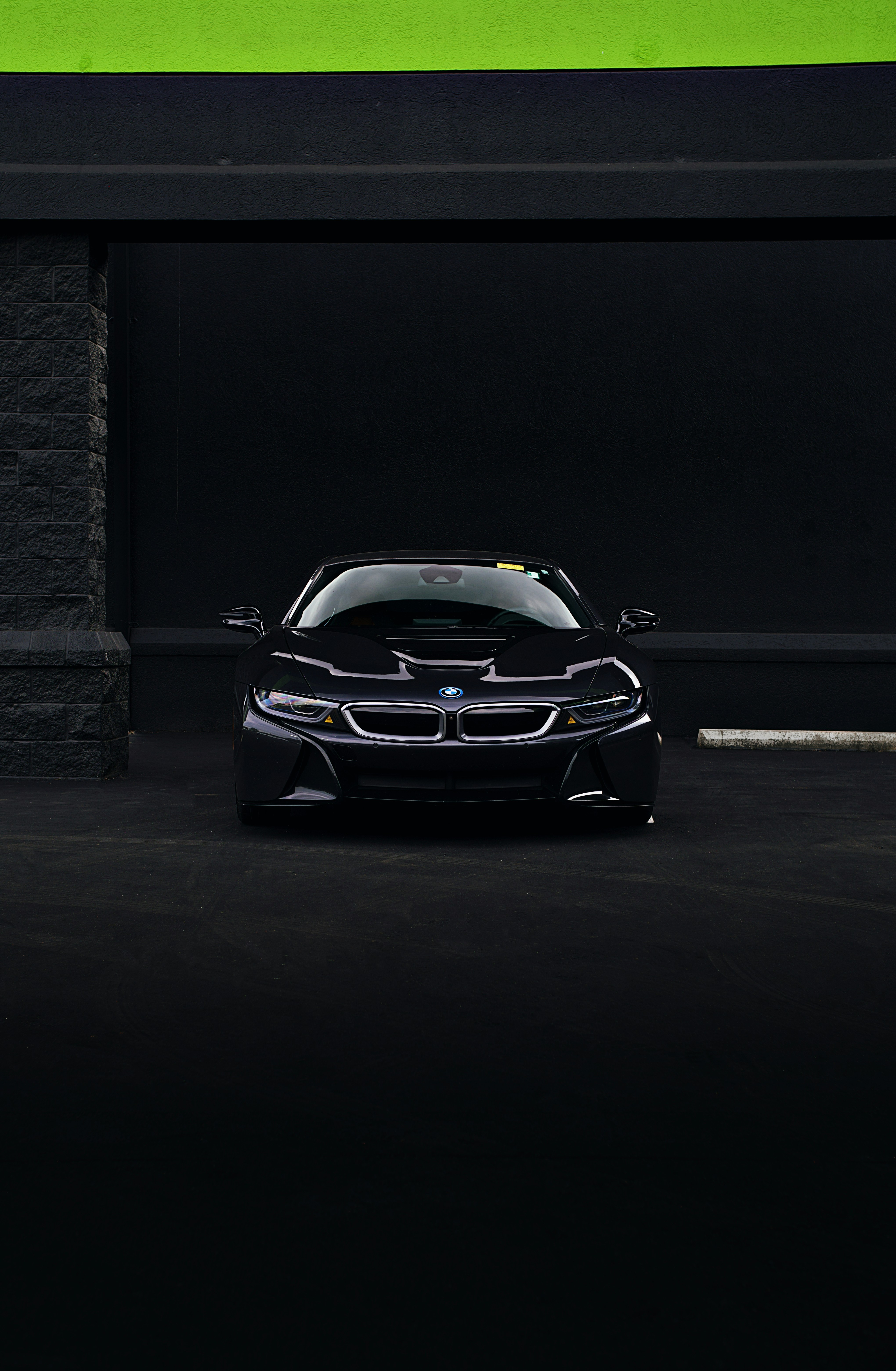 A sleek, black BMW i8 is perfectly centered.