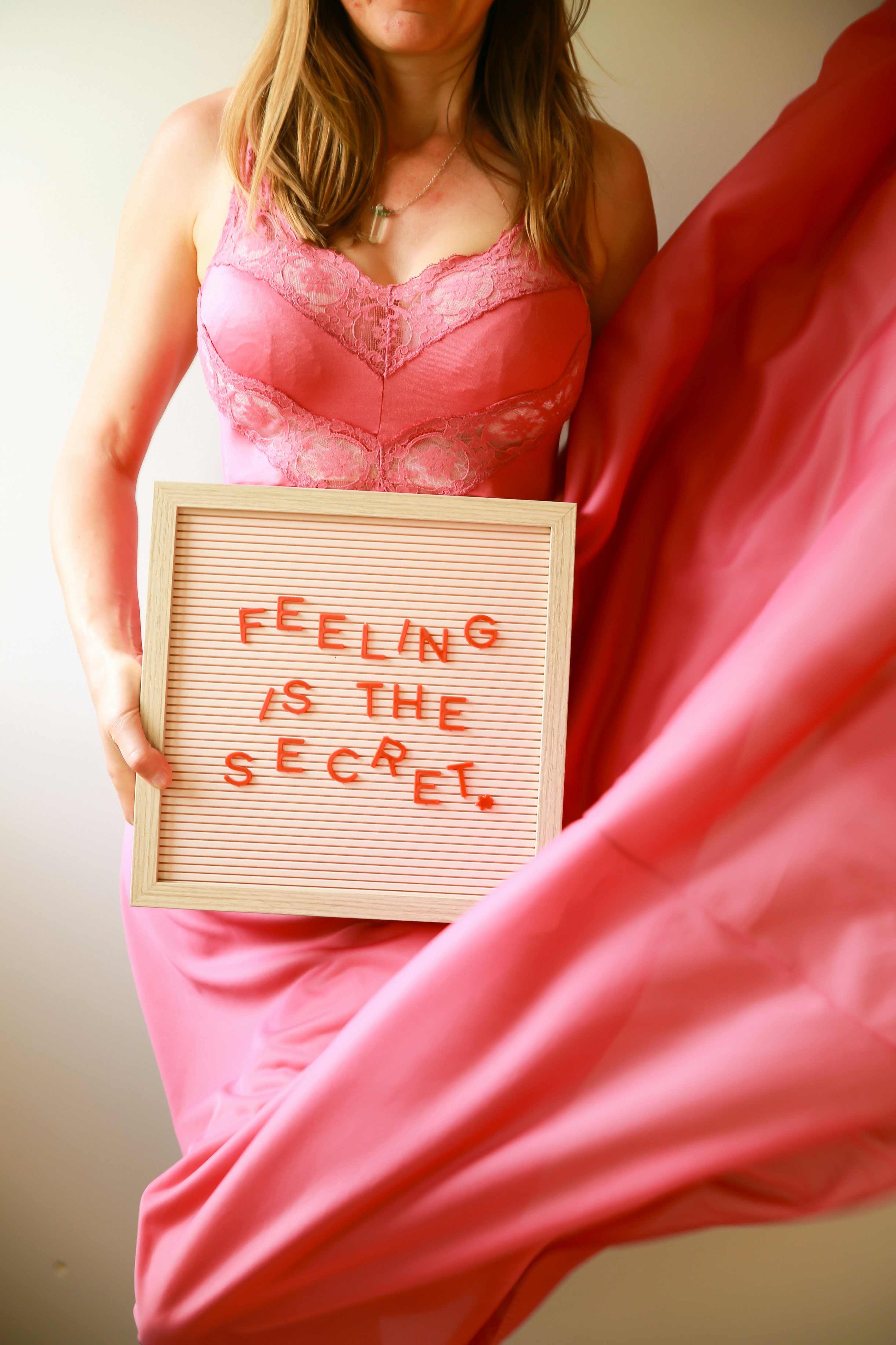 Woman holds sign that says 