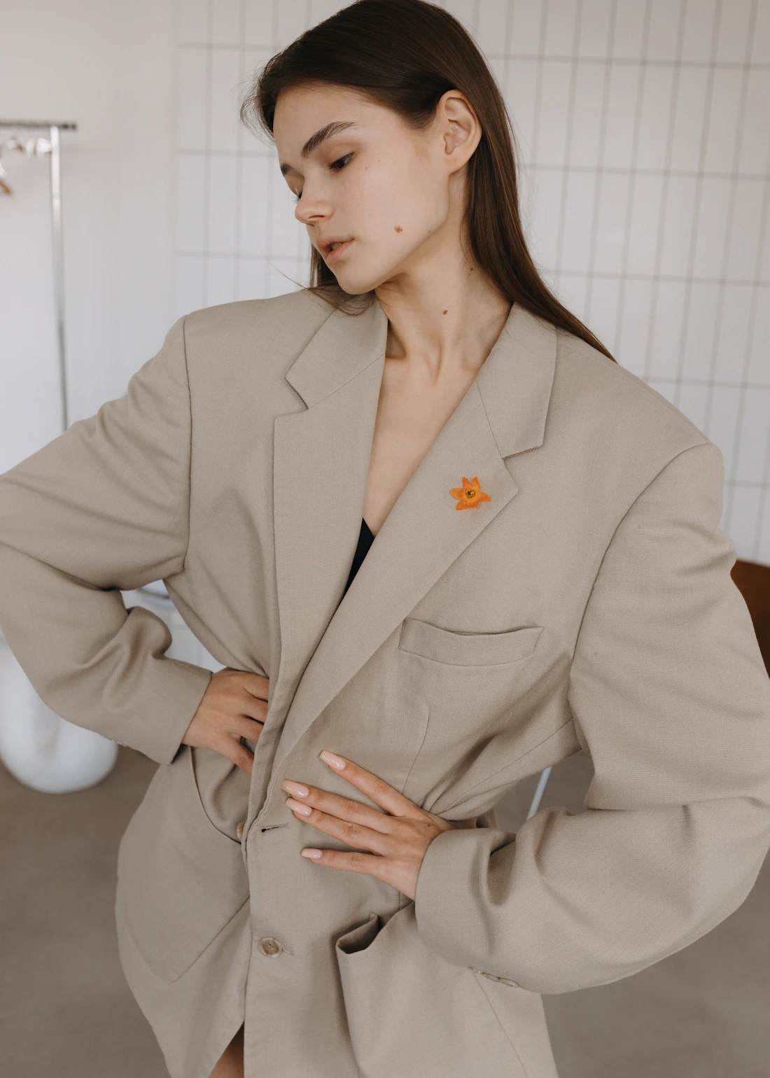 Brunette fashion model in a beige oversized tailored look