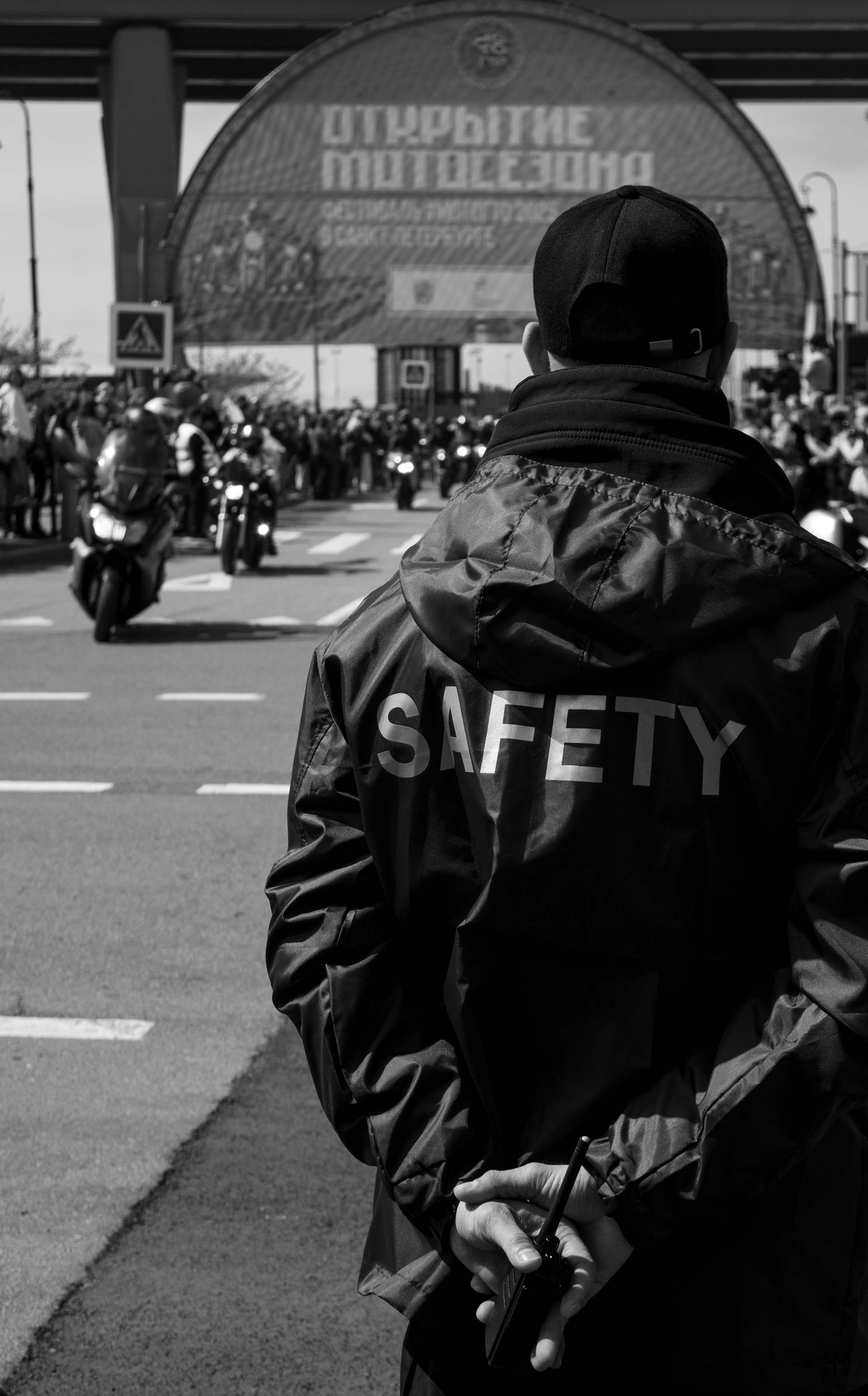 A safety officer watches a motorcycle event.