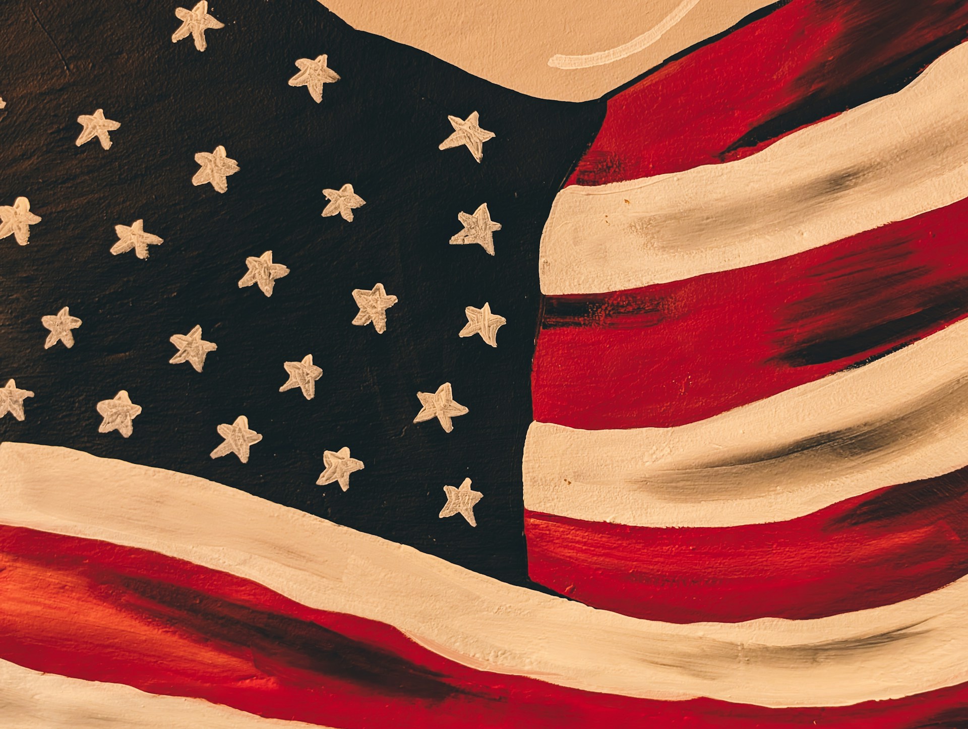 The american flag is waving in the wind.