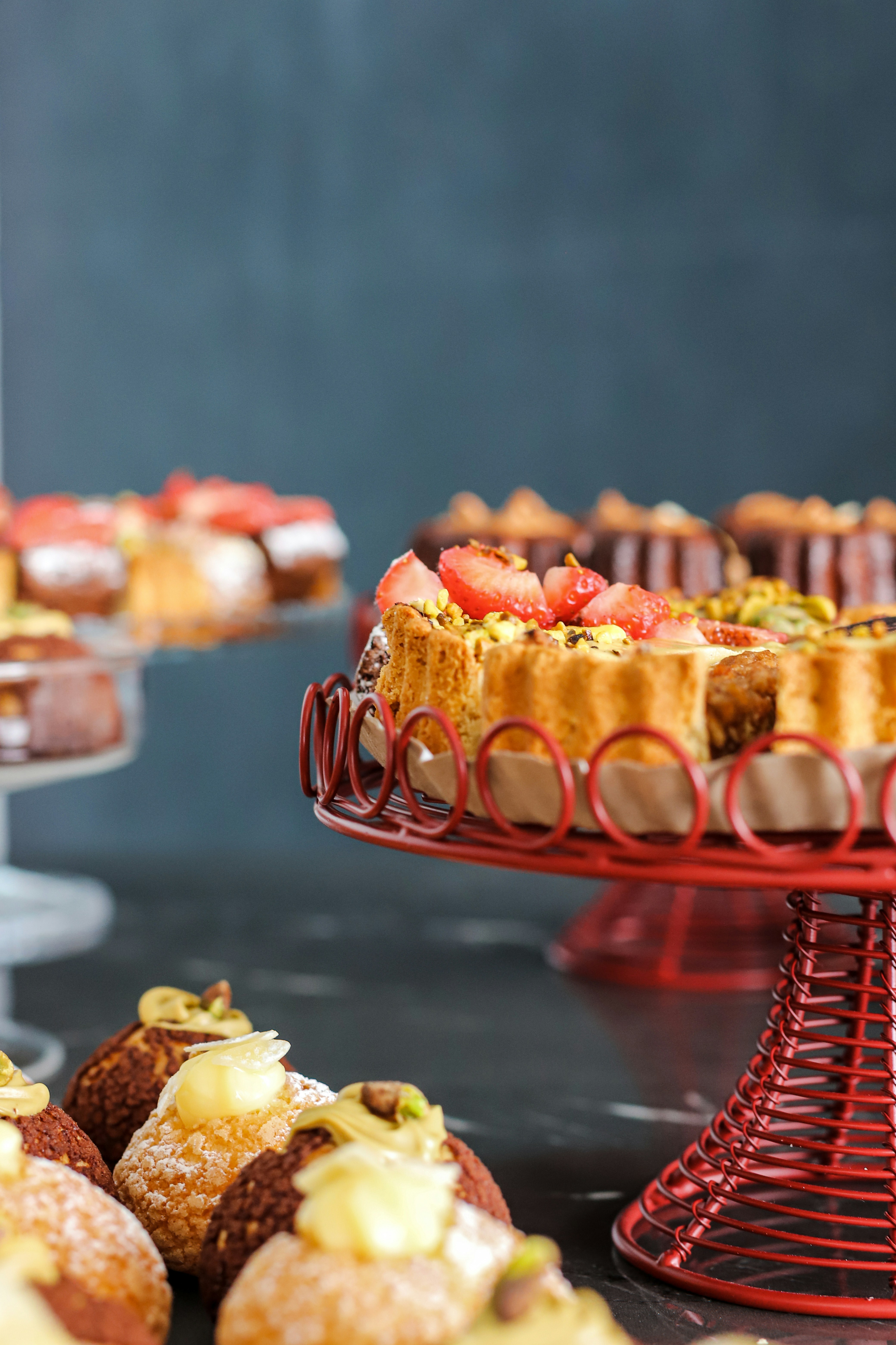 Assorted pastries and tarts arranged on display.