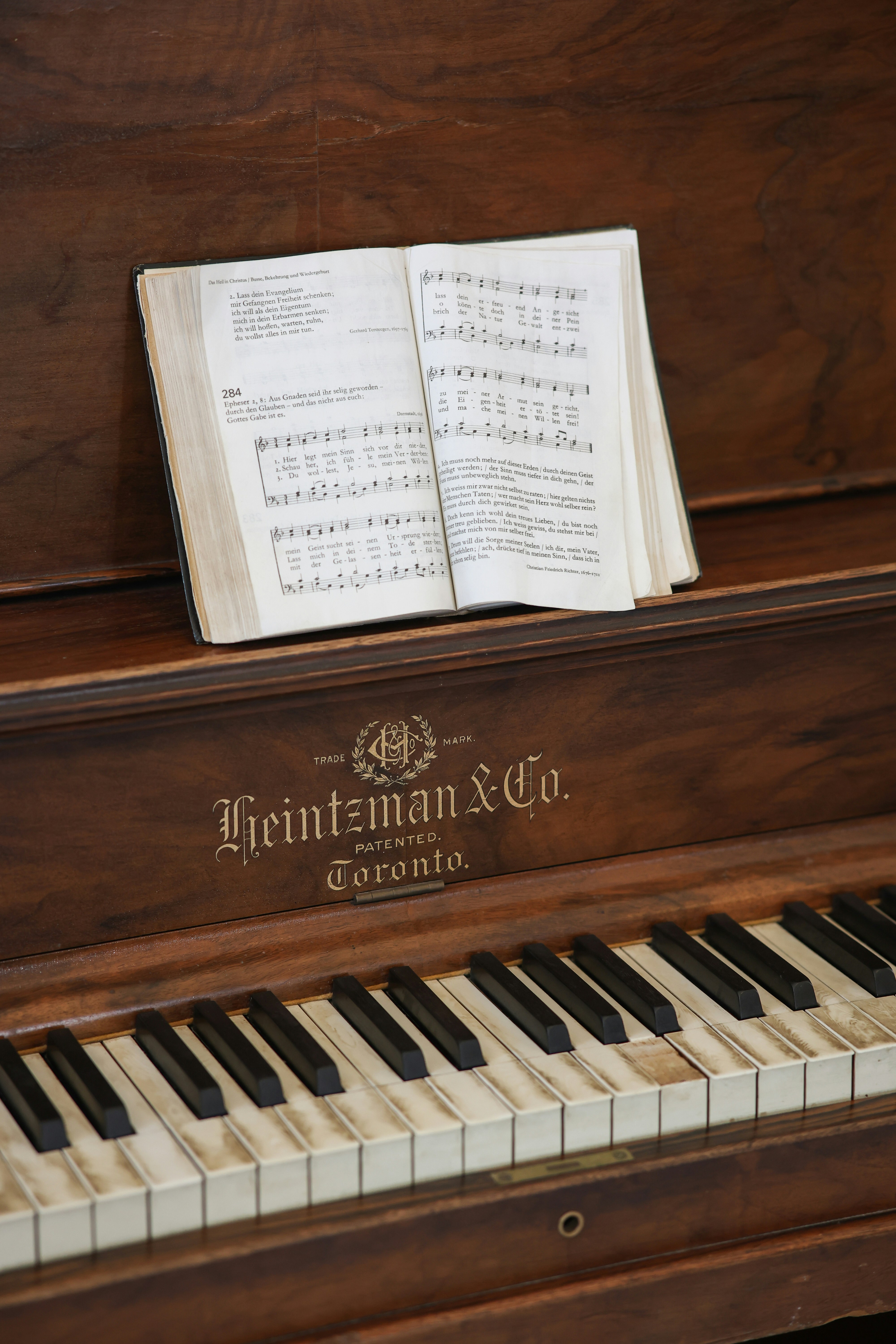 A piano has sheet music on it.