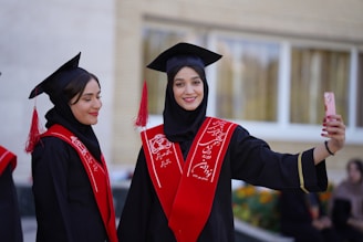 Graduates pose for a selfie at their ceremony.