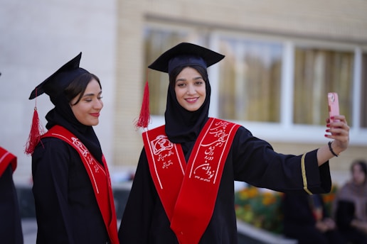 Graduates pose for a selfie at their ceremony.