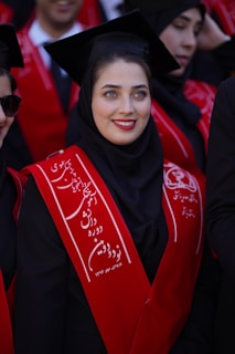 A graduate smiles happily during her commencement.