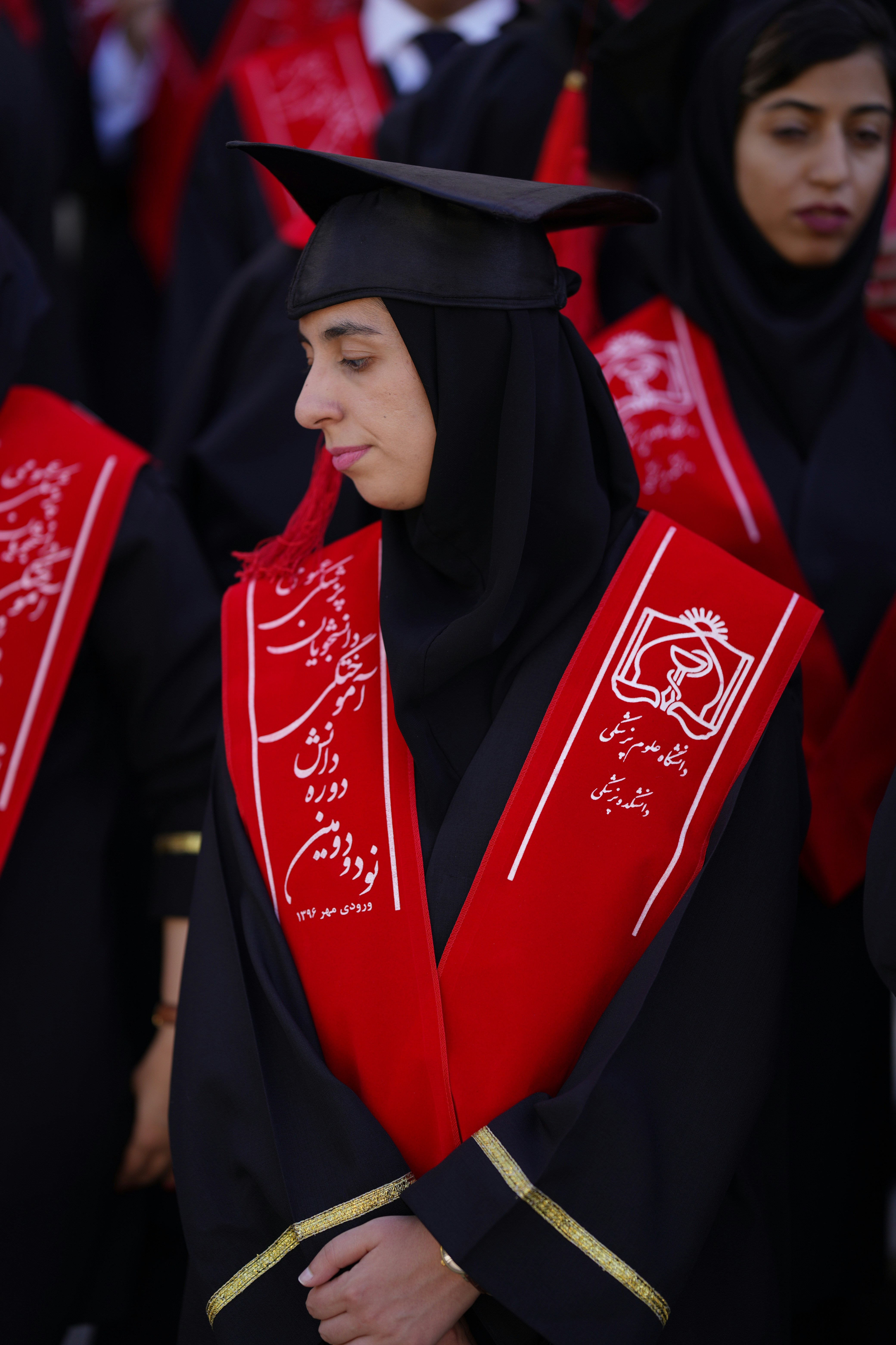 Saudi women in traditional attire engaging in a community event