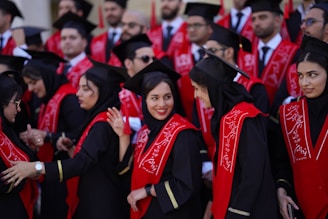 Graduates celebrate with caps and gowns.