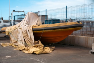 A boat is covered with a tarp.