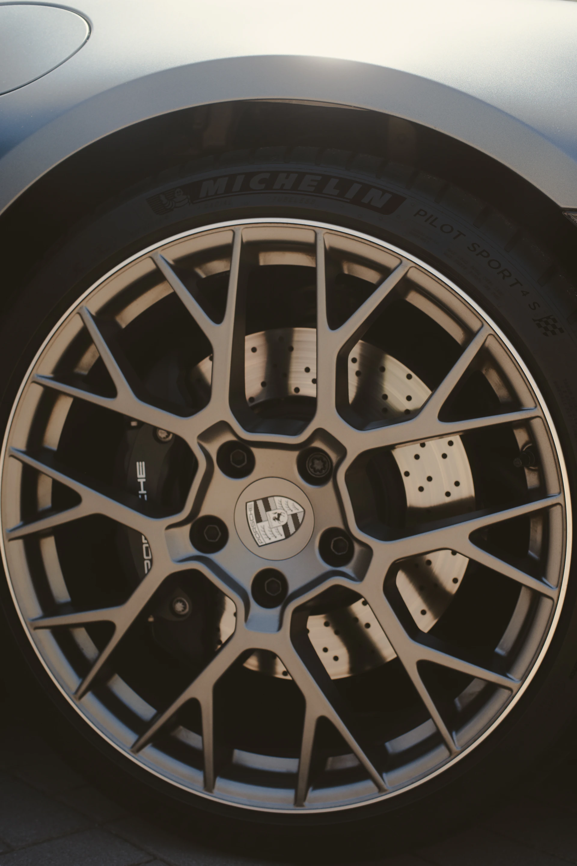 A detailed shot of a porsche wheel.