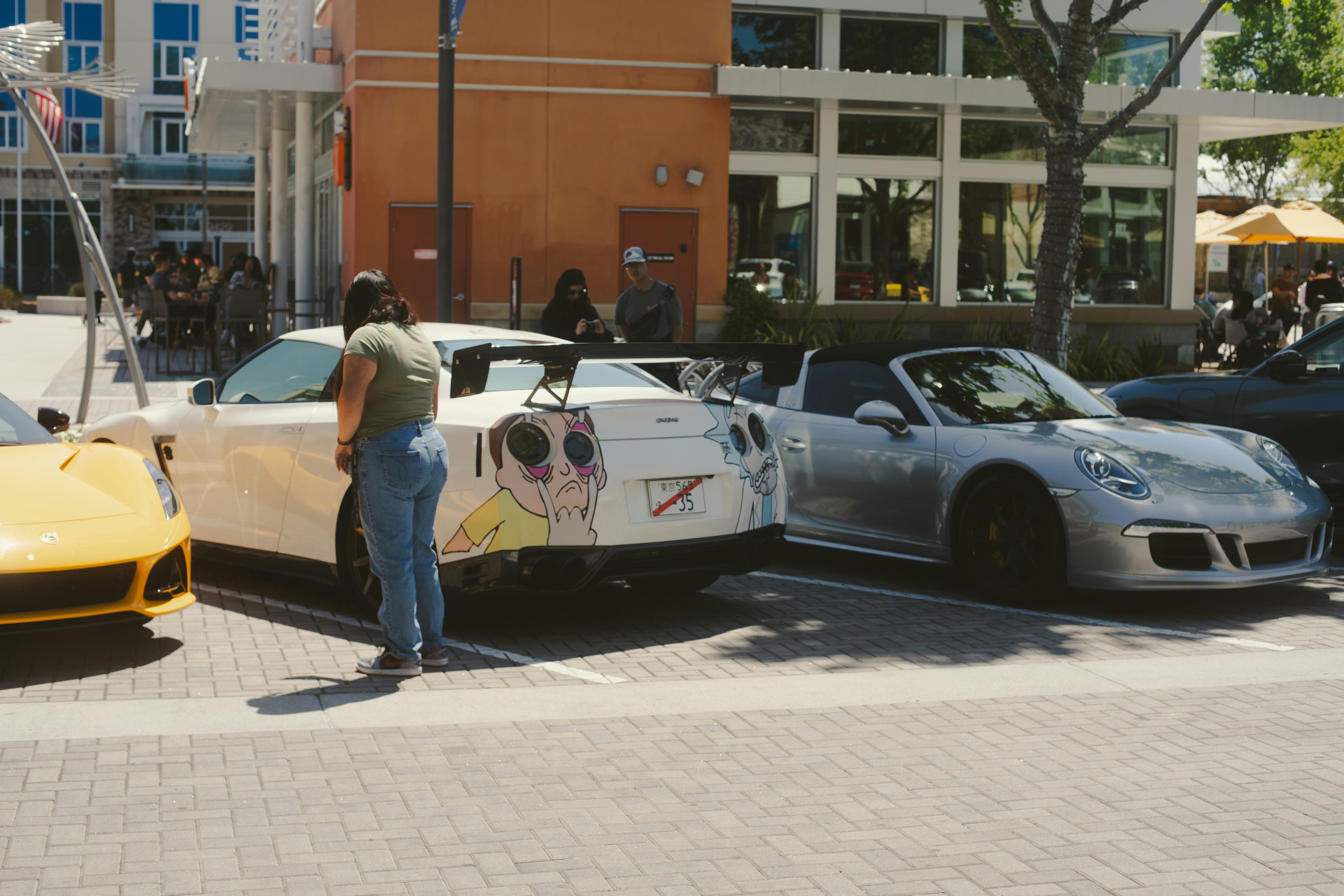 Cars are parked, possibly at a car show.