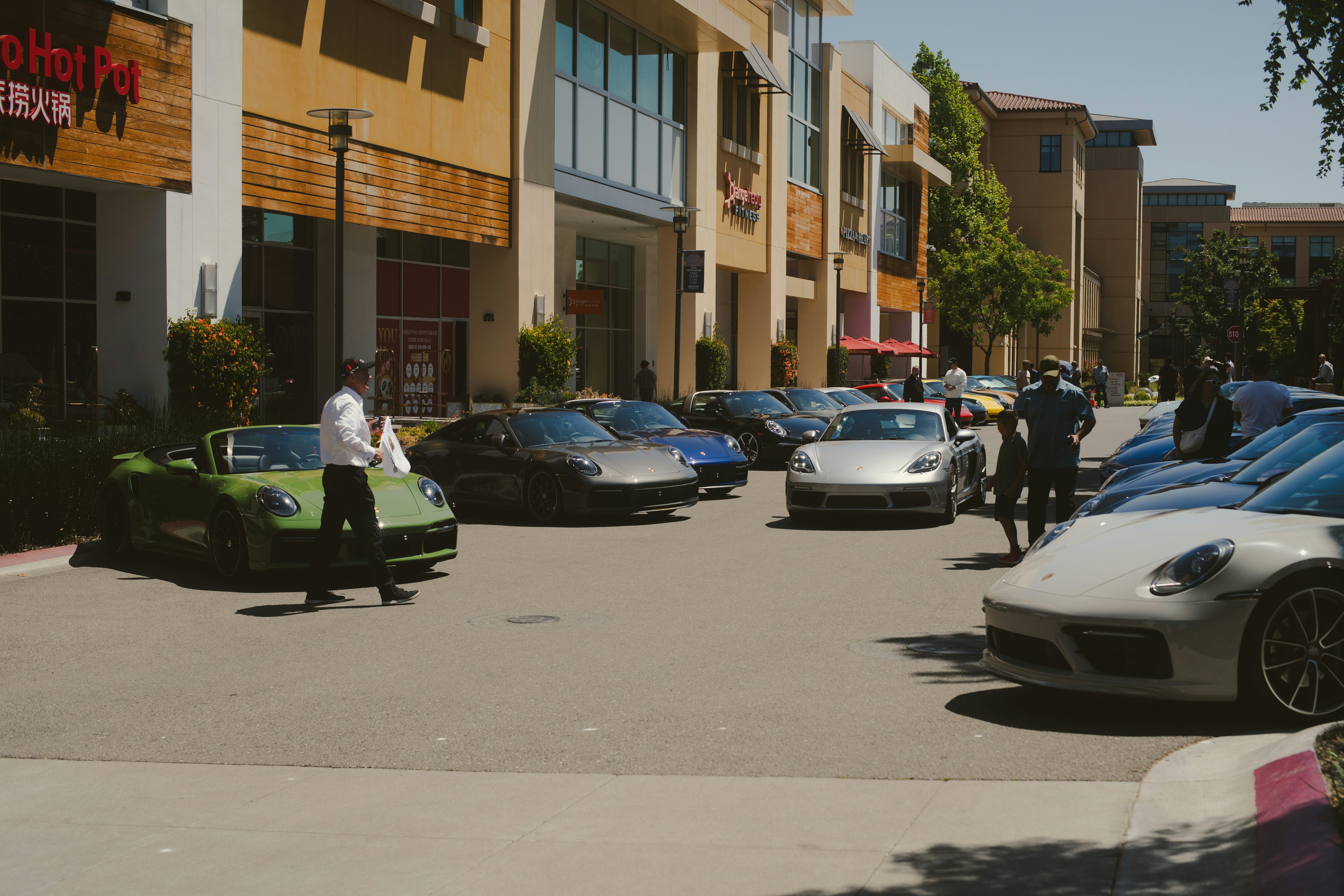 Row of used e vehicles lined up on a dealership lot ready for sale