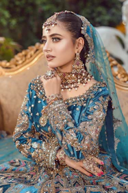 A bride in a beautiful, elaborate, and expensive outfit.