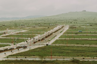 New development plots are carved out in a grassy area.
