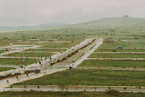 New development plots are carved out in a grassy area.