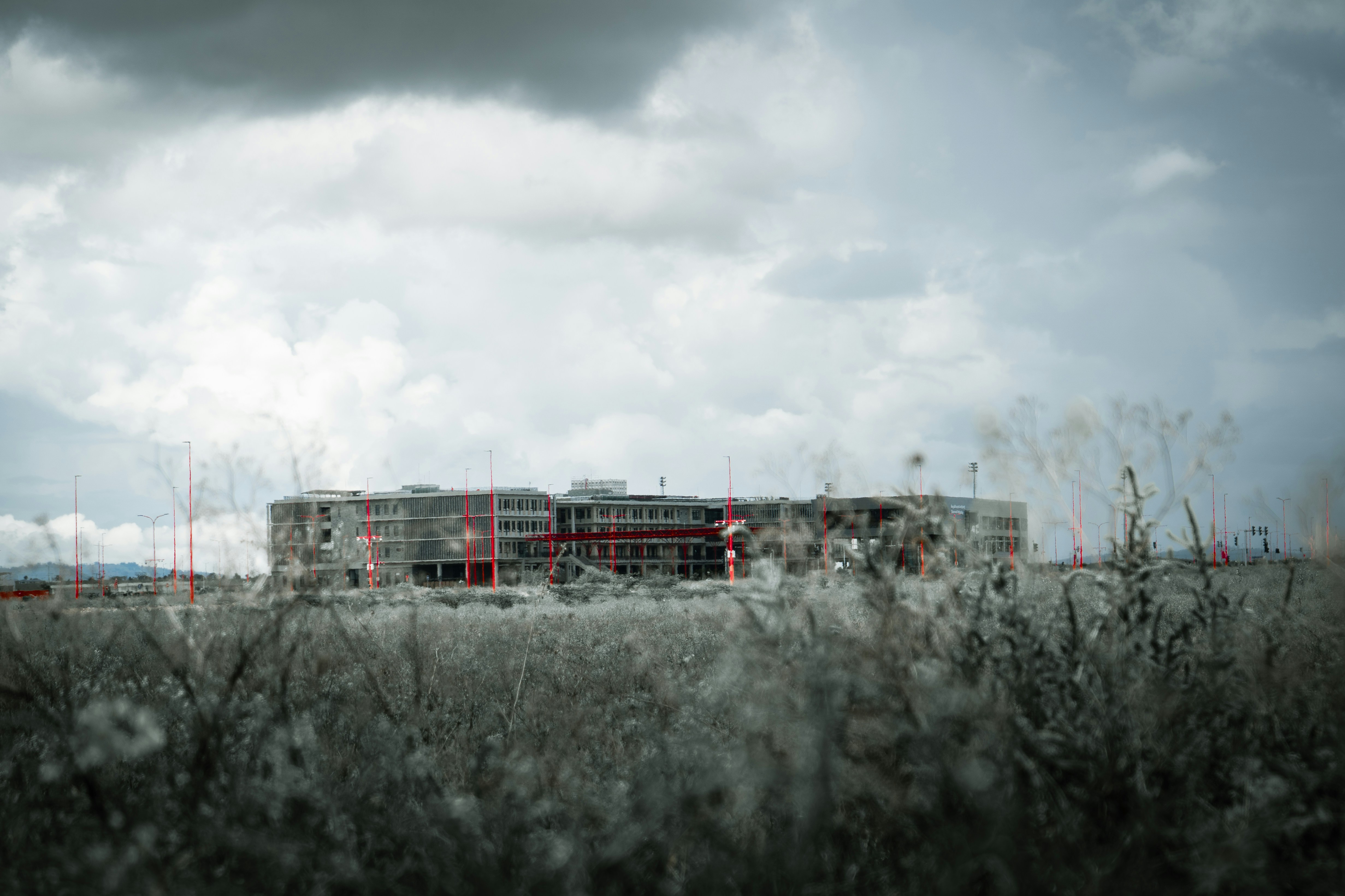 A building stands under a cloudy sky.
