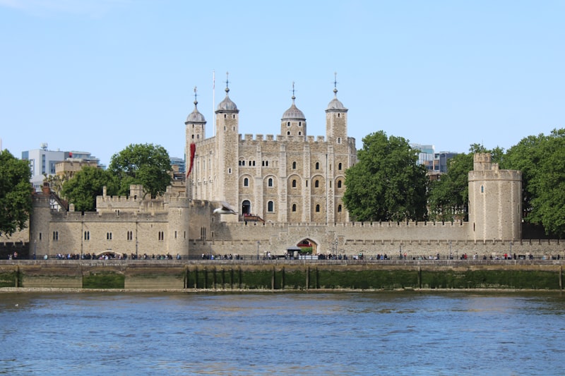Tower of London fortress with its medieval stone walls beside the Thames