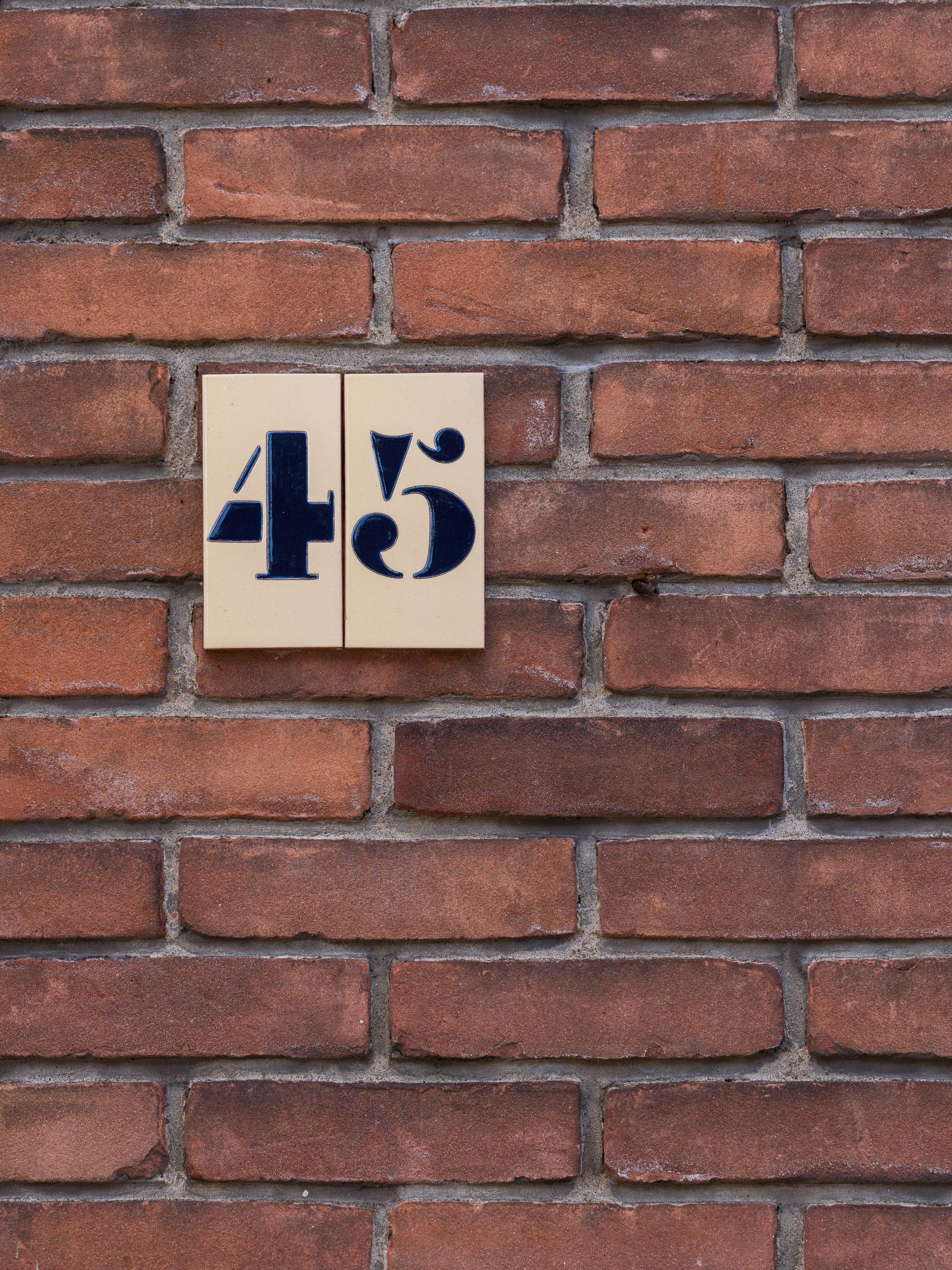 Brick wall with the number forty-five.