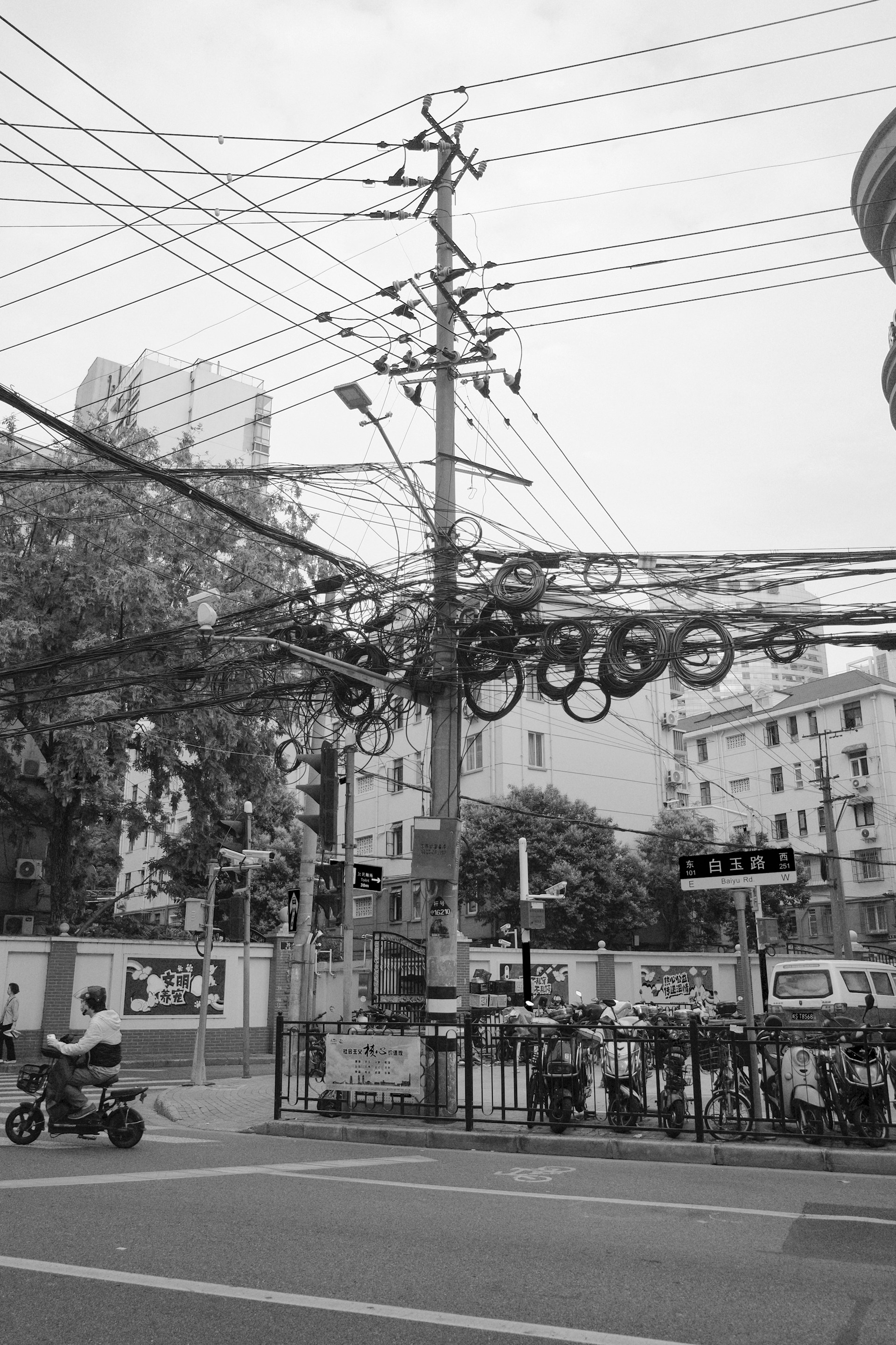 Electric wires and tires decorate a utility pole.