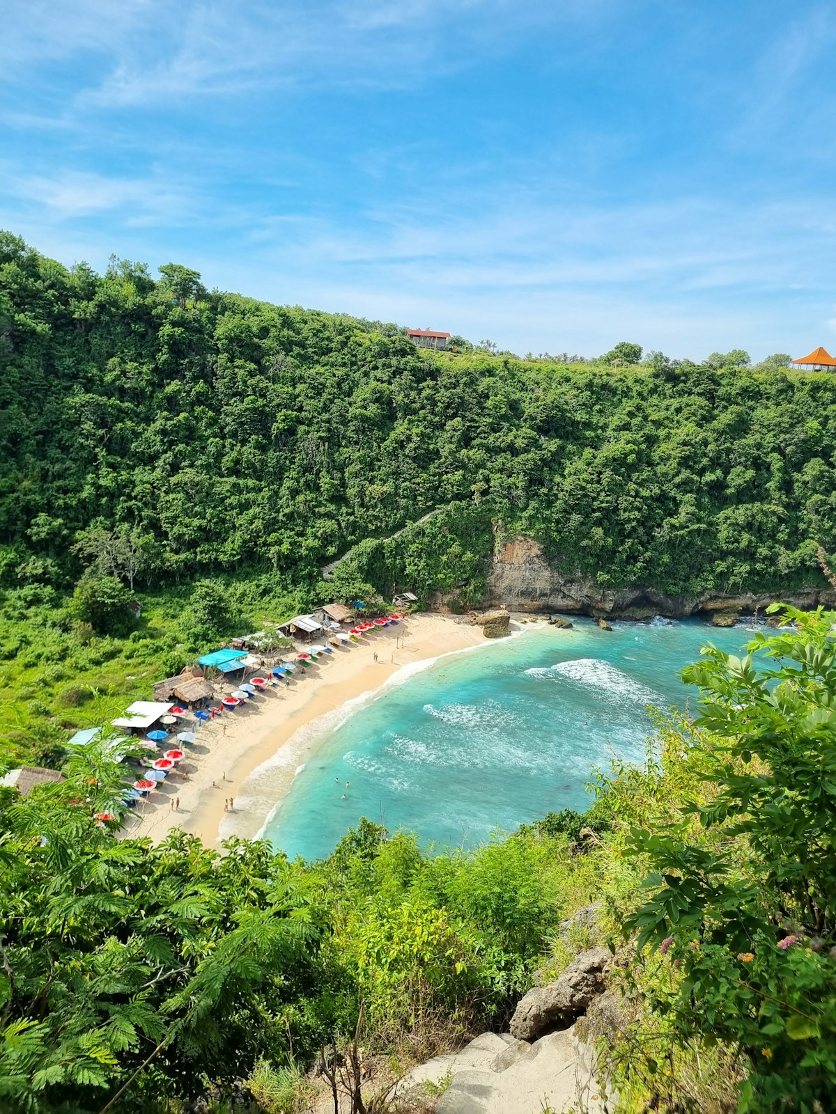 Atuh Beach Nusa Penida — pristine beach surrounded by verdant cliffs and turquoise water