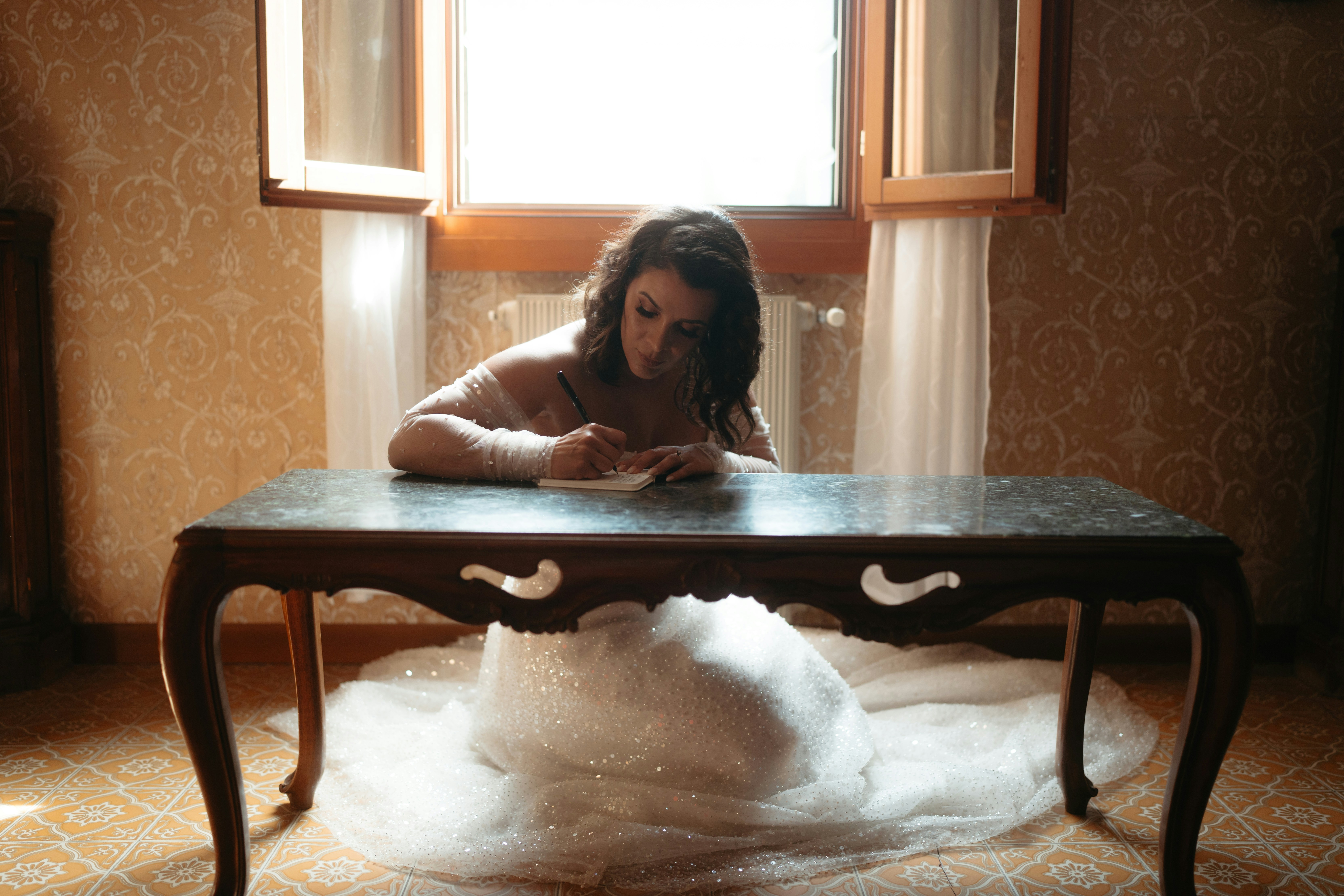 Writing out vows for a beautiful Venice elopement