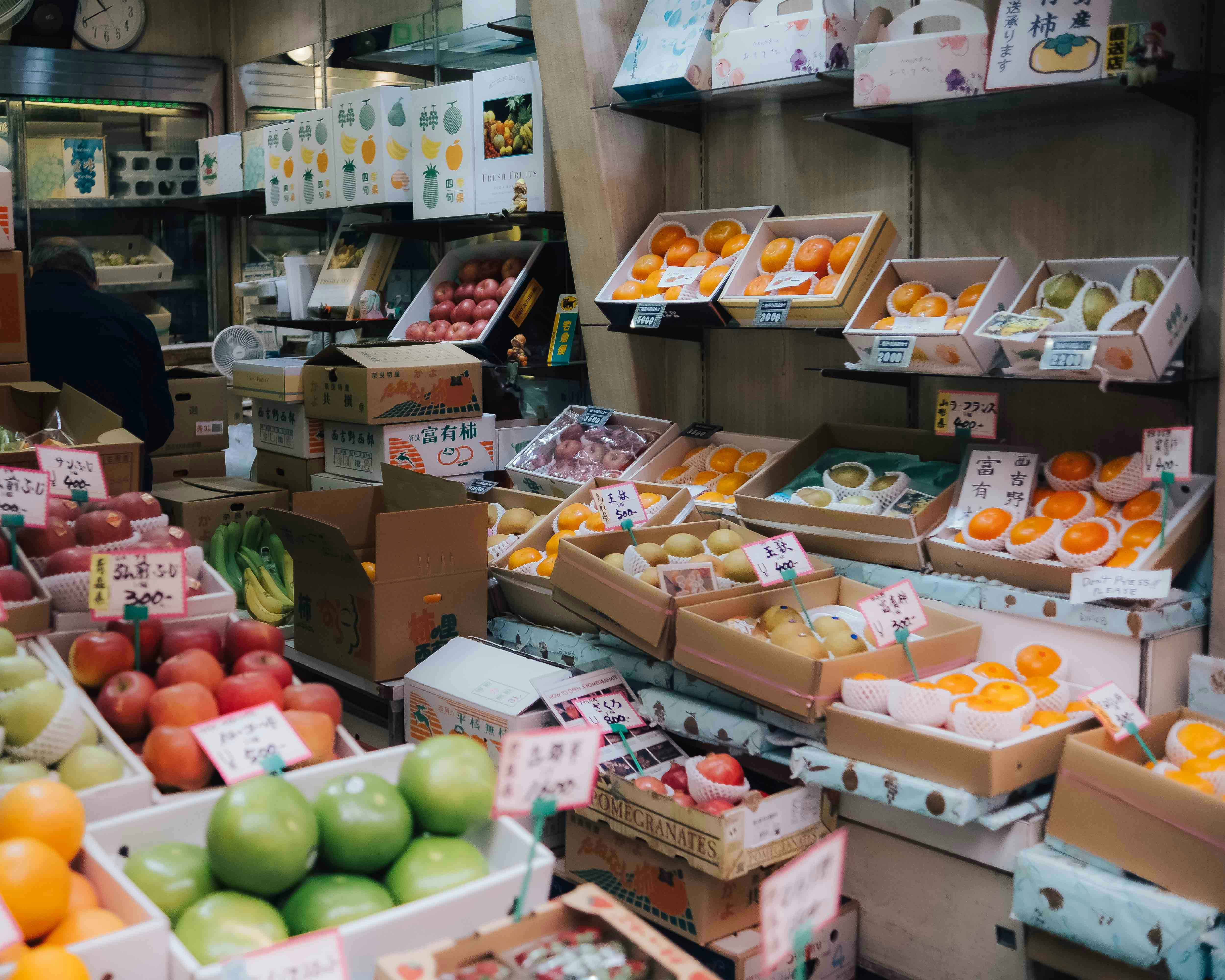 Japanese supermarket produce section with fresh fruits and vegetables