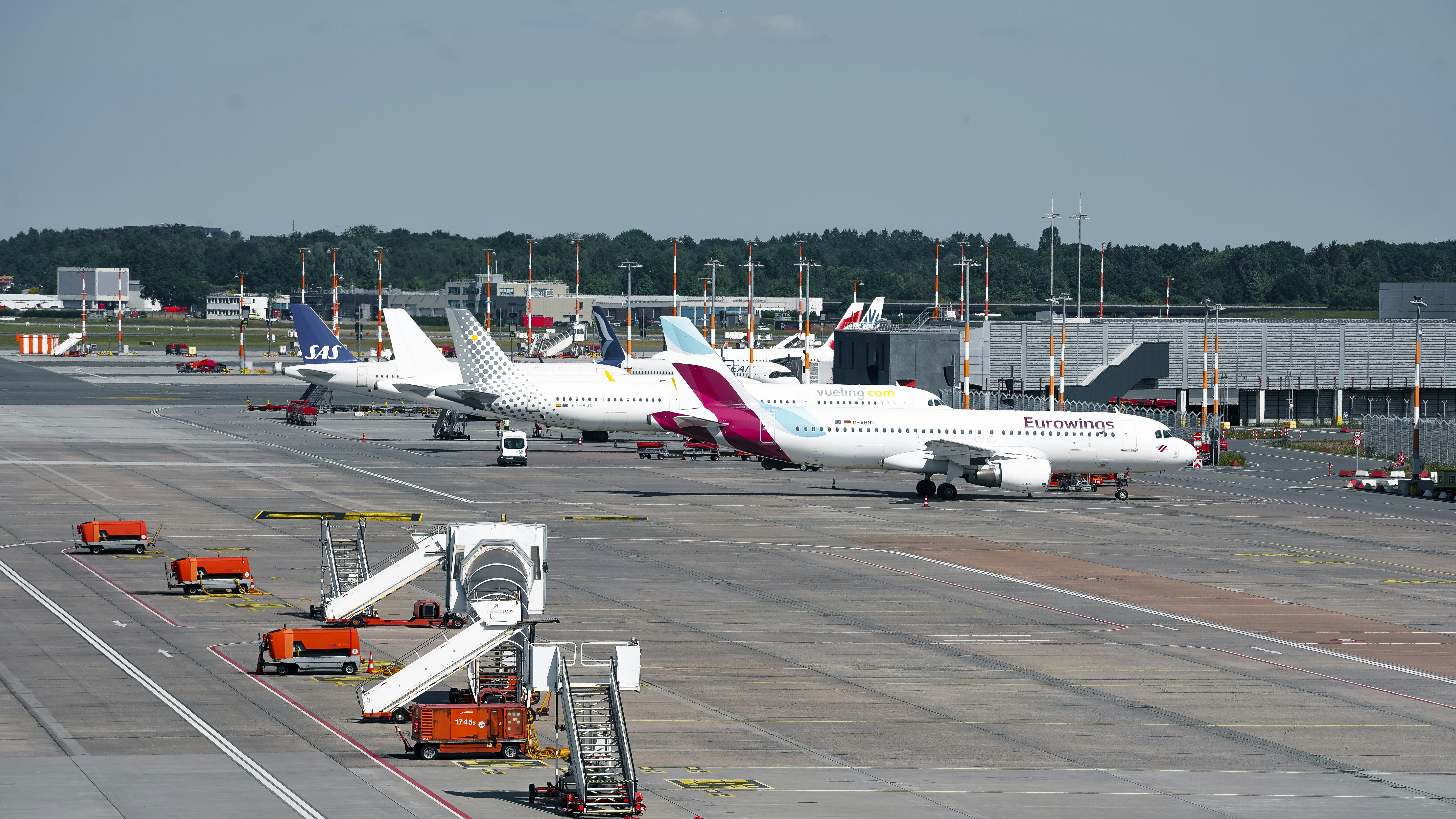 Airplanes parked at an airport terminal.