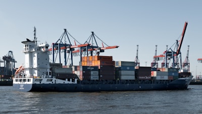 A cargo ship is docked at the port.