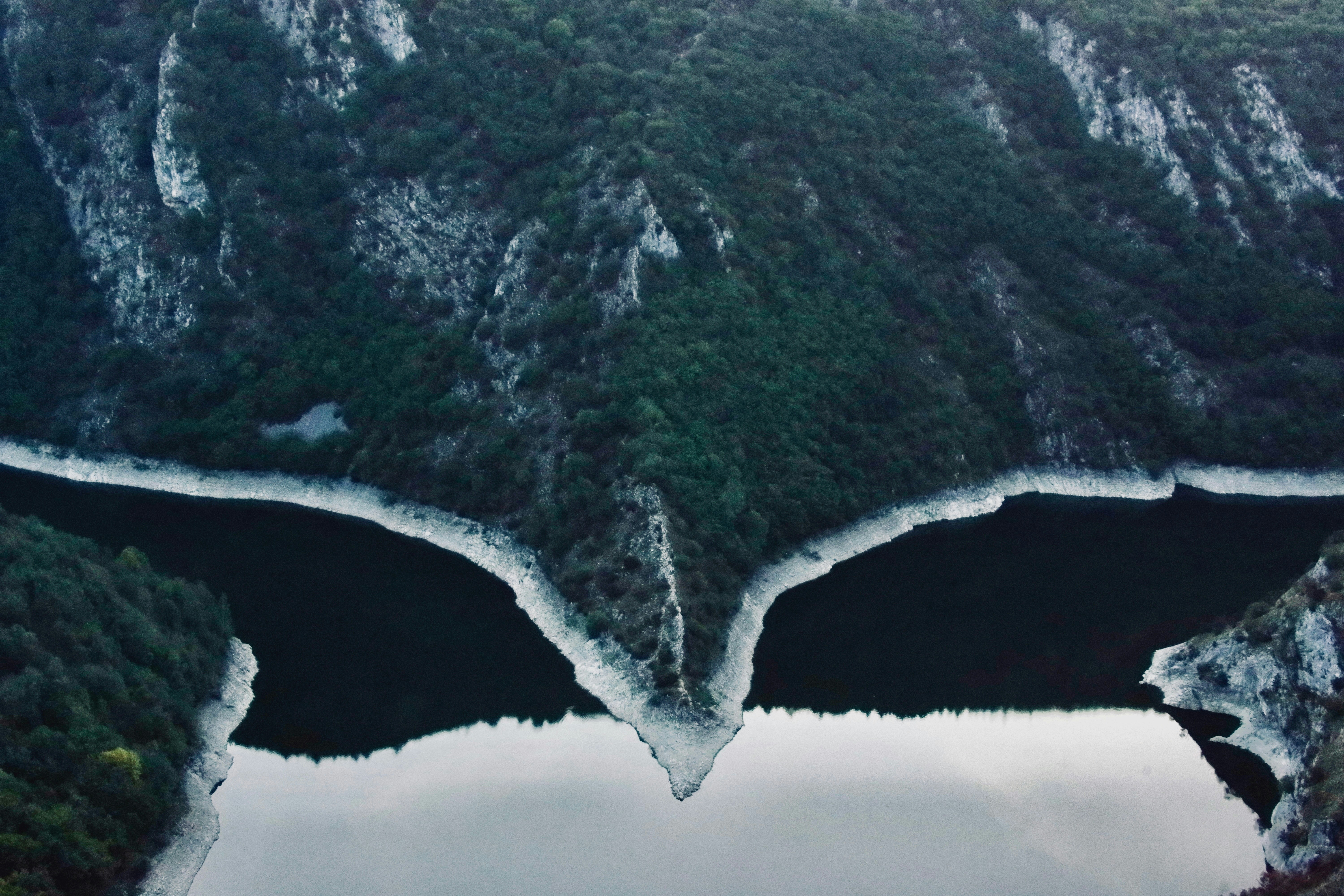 Mountains and water create a dramatic mirrored landscape.