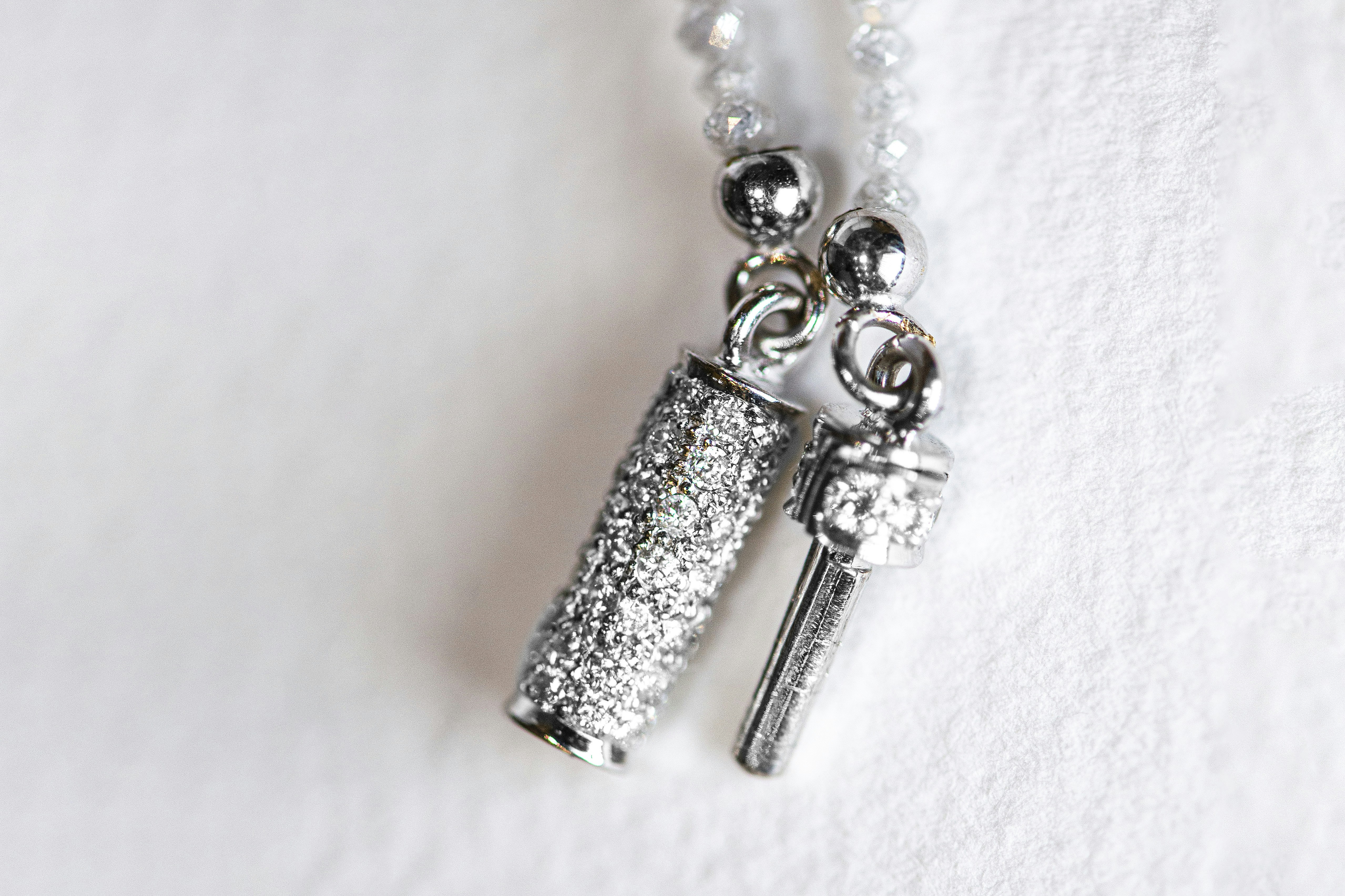 A sparkly jewelry clasp is visible.