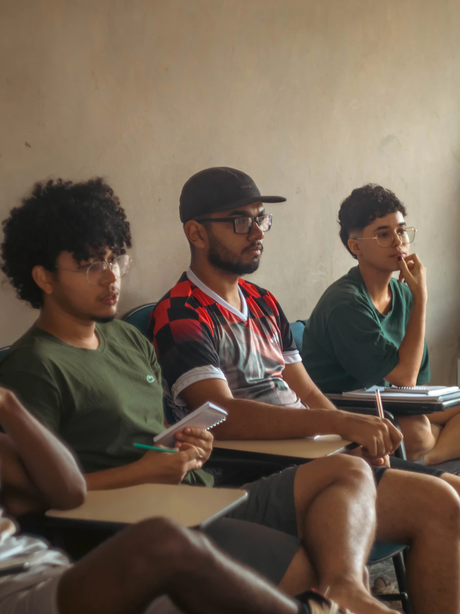 Students sitting attentively and listening during a class