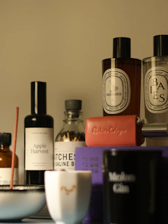 Luxurious fragrances and accessories are arranged.
