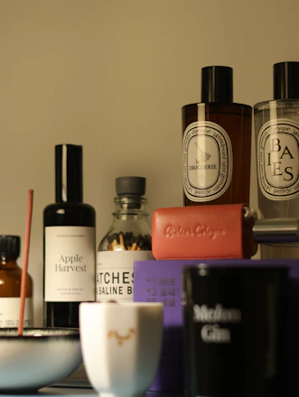 Luxurious fragrances and accessories are arranged.
