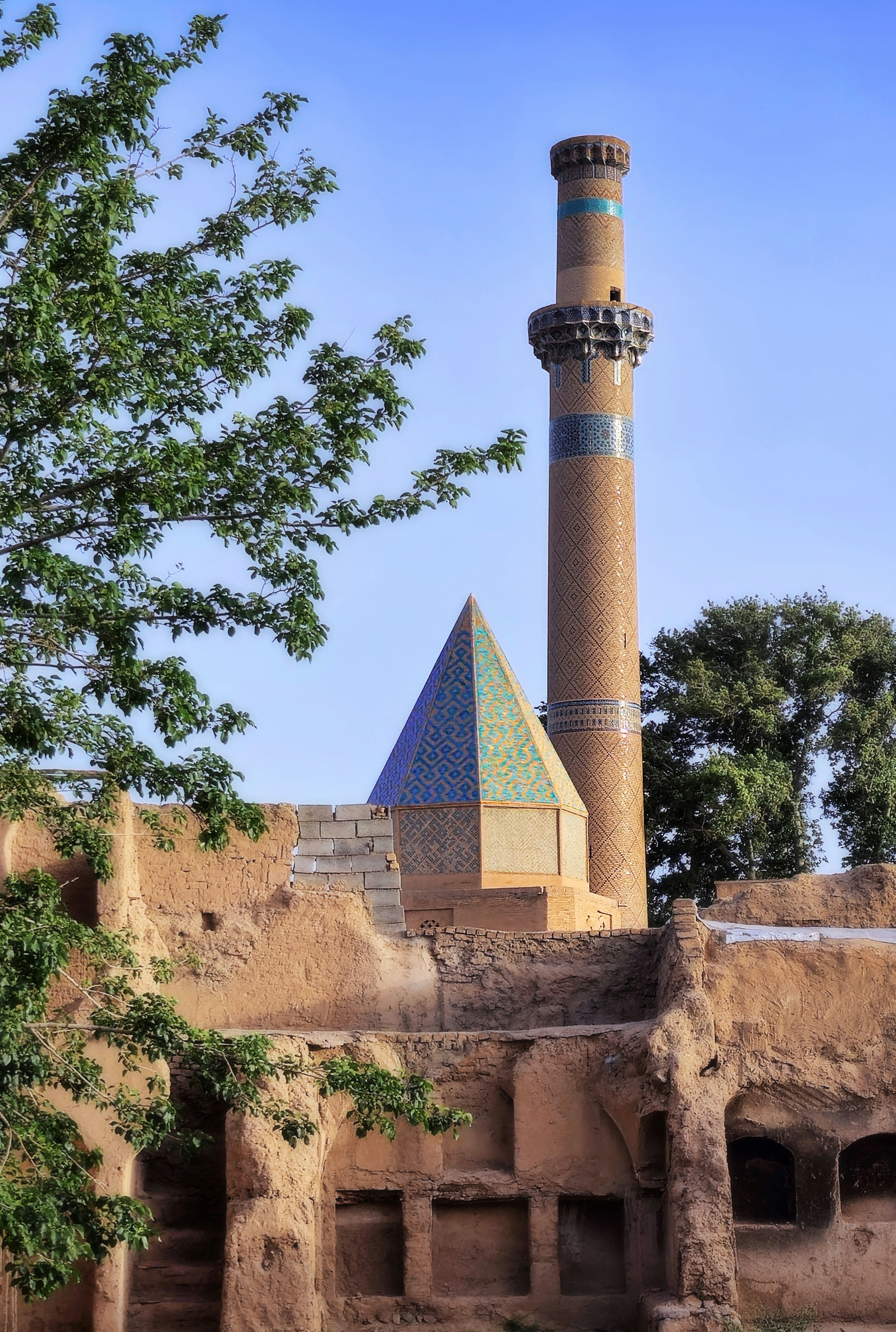 An ancient middle eastern building with a minaret.