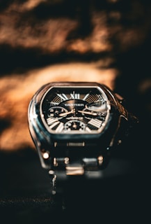 A cartier watch is displayed in close-up.