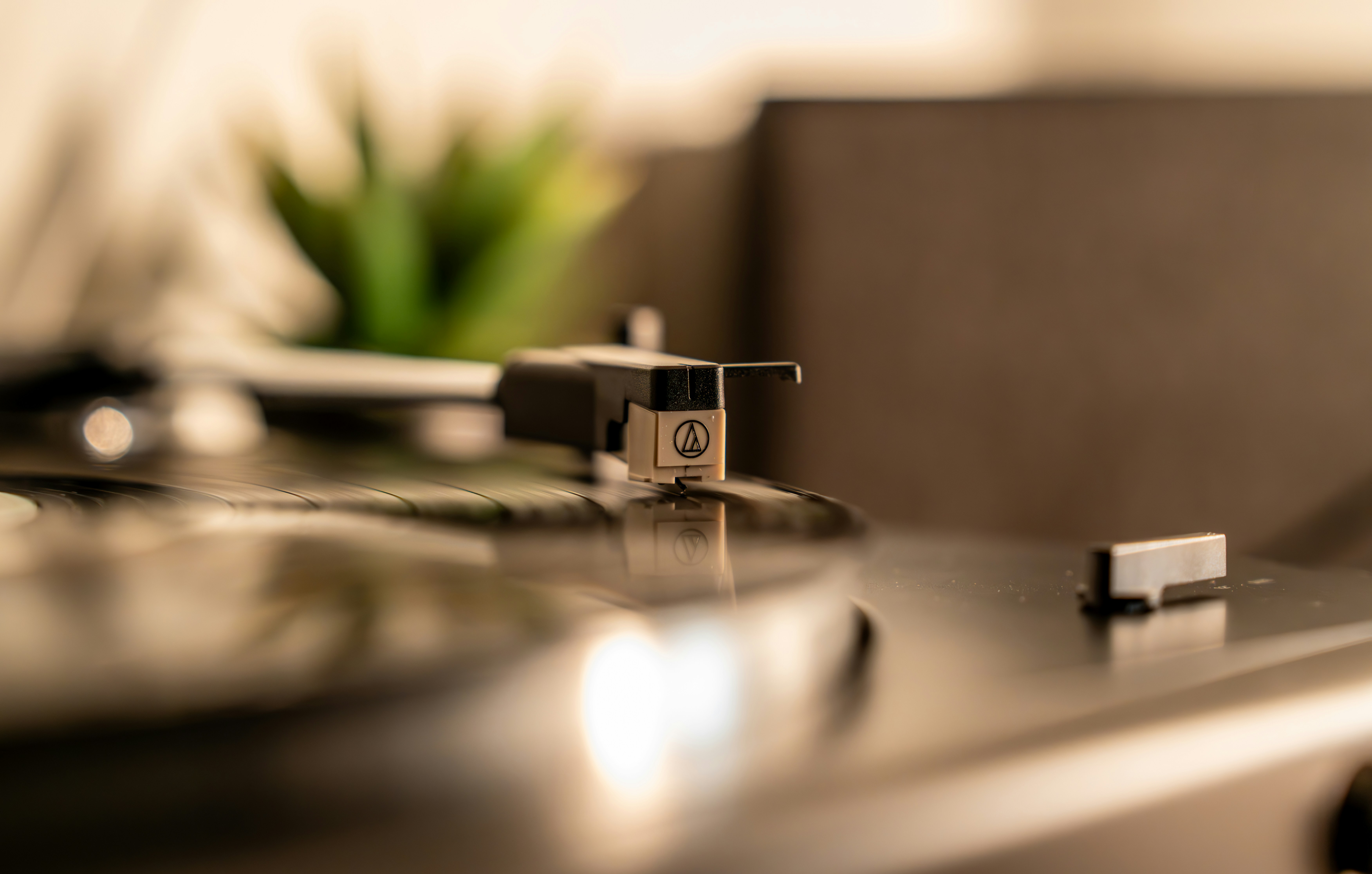 A record player needle on a vinyl record.
