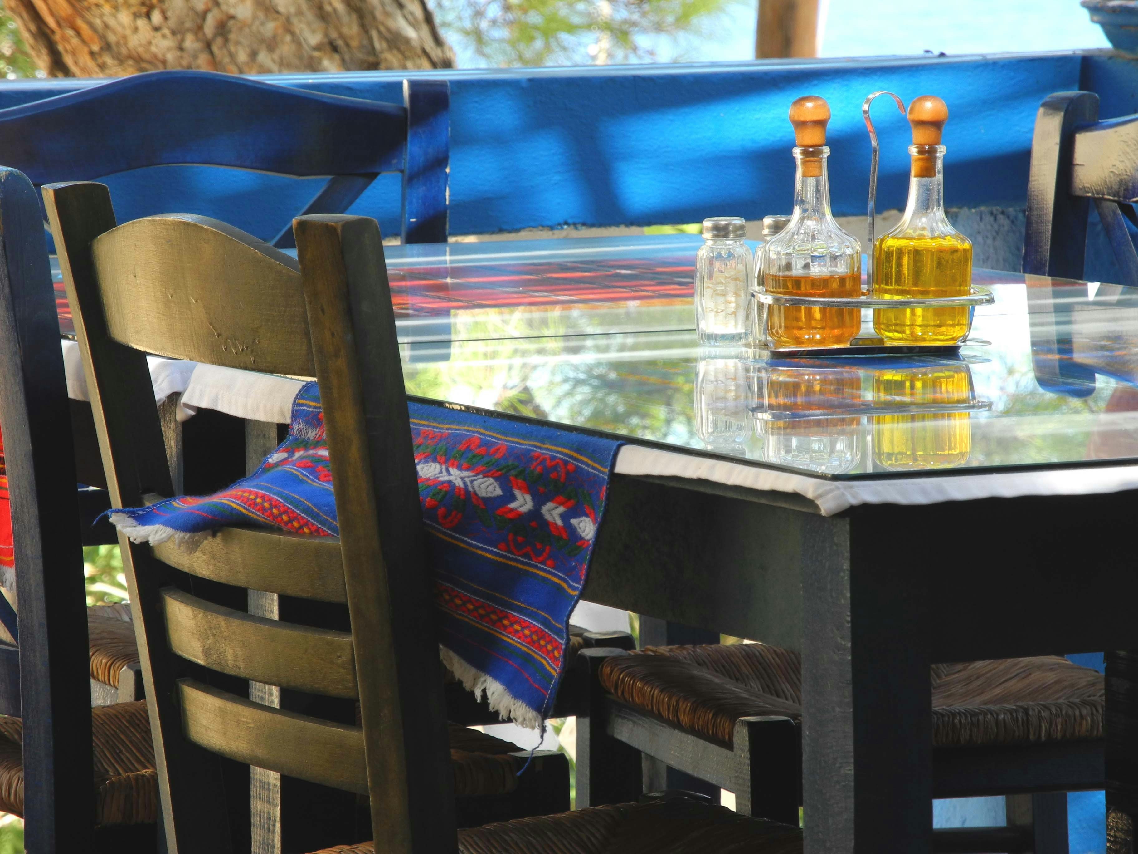 Dining table set for eating with bottles of oil.
