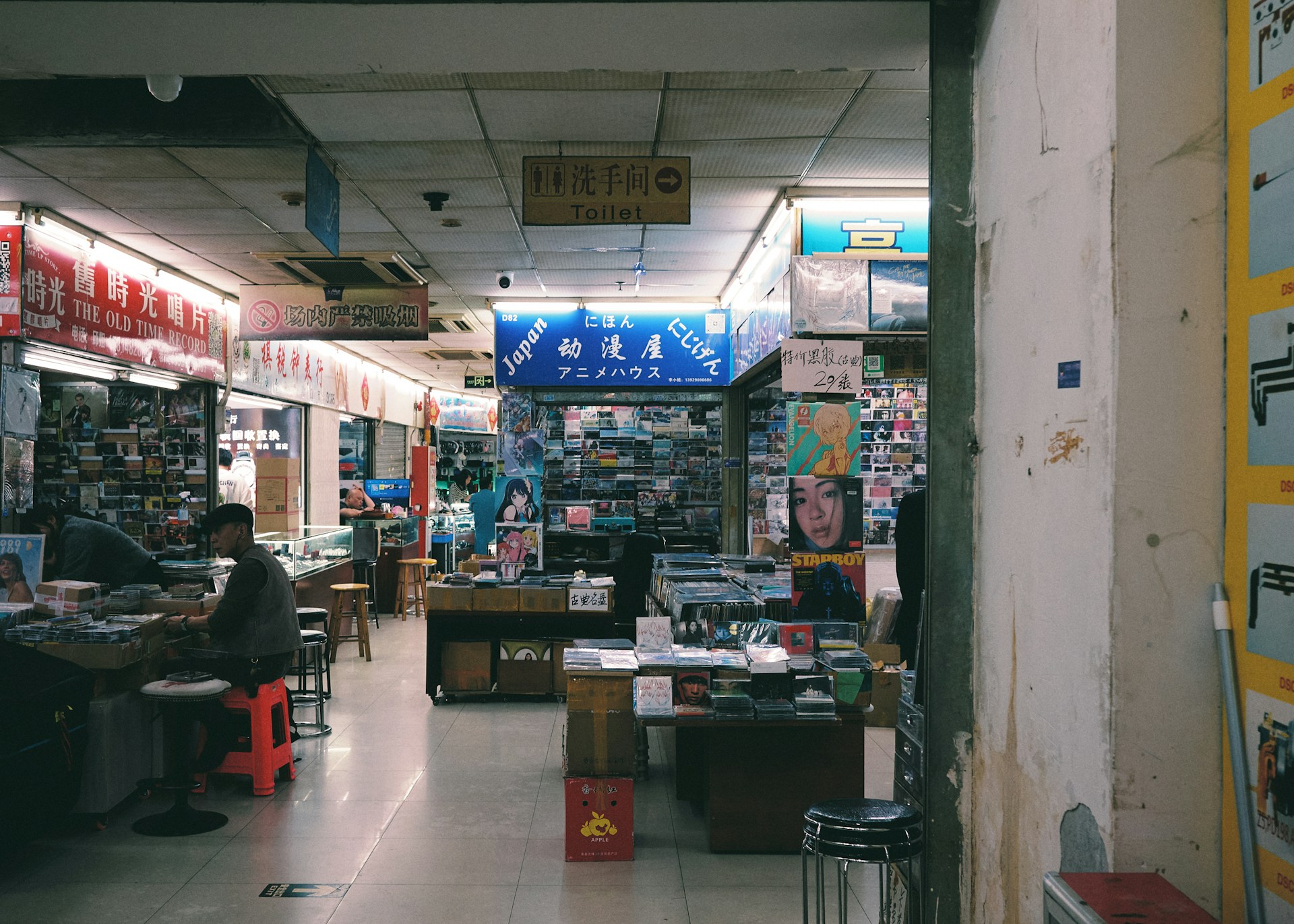 Inside of a shop in a bustling market.