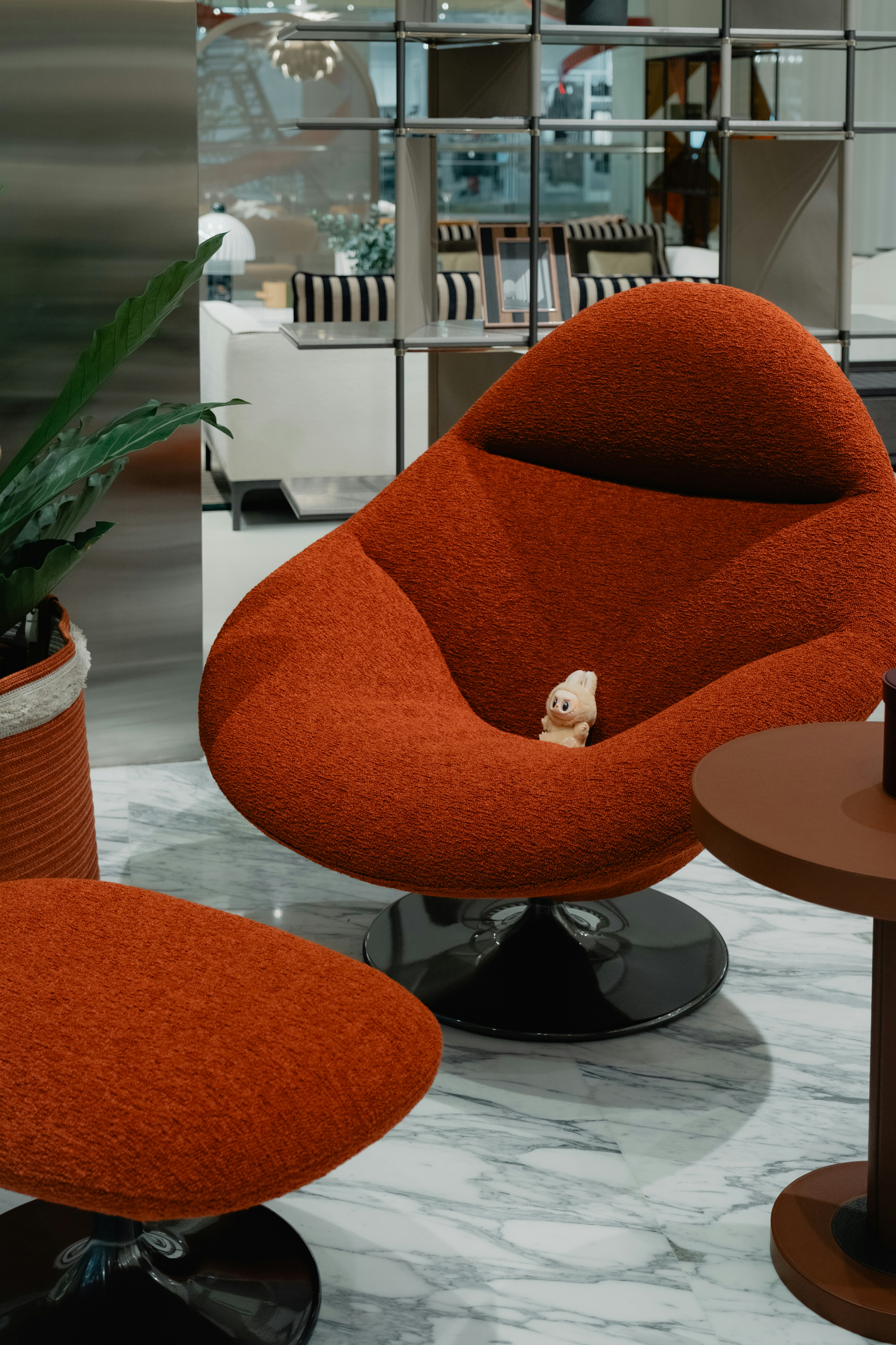 A cozy upholstered lounge chair with a matching ottoman