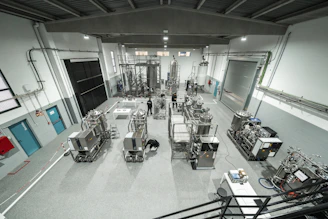 Inside a large industrial factory building.