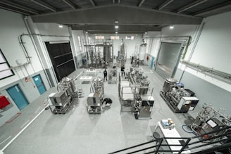 Inside a large industrial factory building.